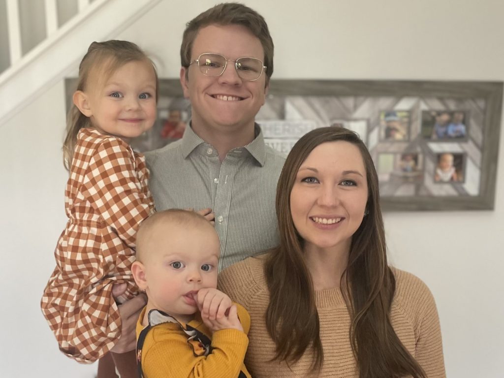 Deacon Jacob Bush with his wife, Kelsey, and their two daughters, Abigail and Elizabeth.